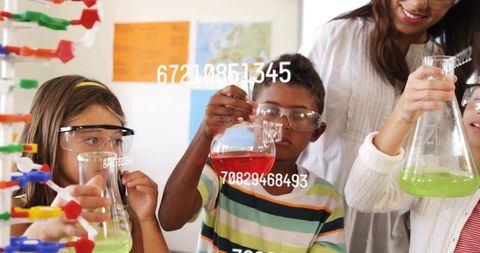 Engaged Children Conducting Science Experiment with Teacher in Classroom - Download Free Stock Images Pikwizard.com