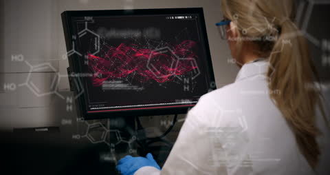 Scientist Analyzing Complex Data on Computer Screen