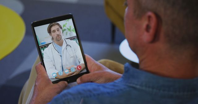 Patient having virtual consultation with doctor using tablet. Ideal for telemedicine services, online medical advice, healthcare technology solutions, remote patient care, and virtual healthcare communication.