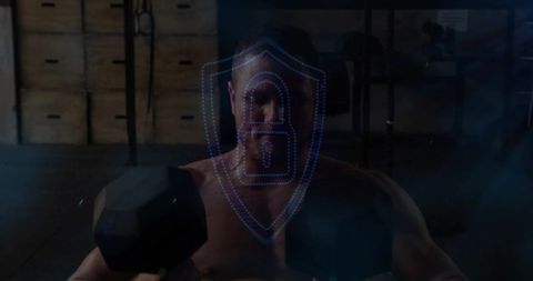 Shirtless man lifting hex dumbbells with holographic blue lock overlay, moody industrial gym
