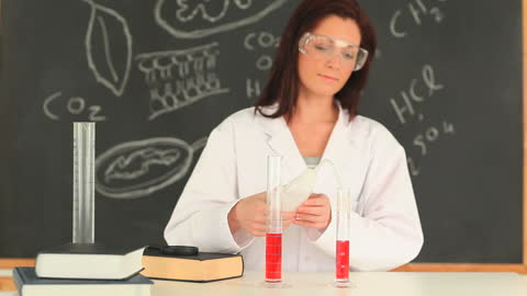 Female Scientist Conducting Lab Experiment with Beakers