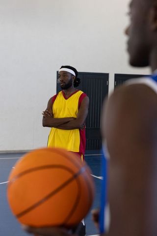 Focused Basketball Players in Action on Indoor Court
