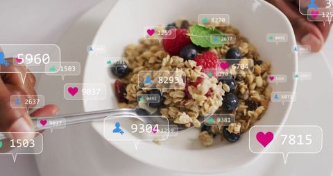 Hand SCOOPing Healthy Berry Granola with Social Media Concept