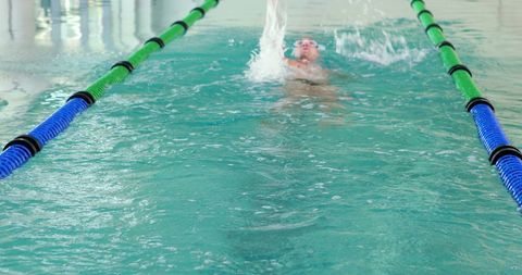 Swimmer Practicing Backstroke in Indoor Swimming Pool - Download Free Stock Images Pikwizard.com