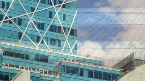 USA Flag Overlaying Modern Cityscape Skyscrapers