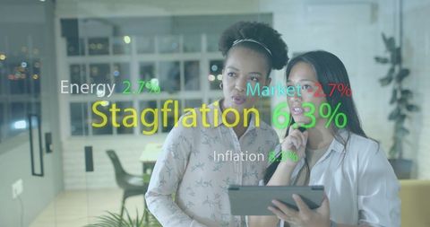 Diverse businesswomen analyzing financial trends in office