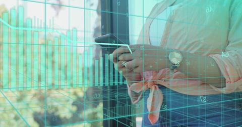 Woman holding phone scrolling financial data with teal analytics grid overlay by window