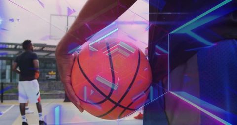 Athlete holding basketball at urban court with neon overlays