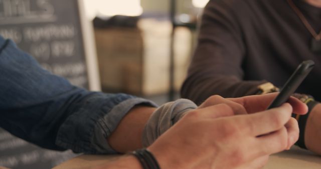 Close-Up of Hands Holding Smartphone in Relaxed Setting - Download Free Stock Images Pikwizard.com