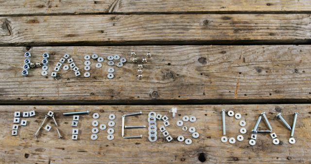 Happy Father's Day Greeting from Nuts and Bolts on Wooden Background - Download Free Stock Images Pikwizard.com