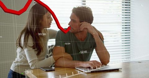 Couple Analyzing Finances with Laptop Discussing Stock Trends
