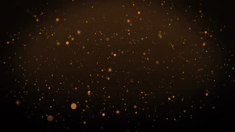 Gold Particles Floating Against Dark Background Creating Elegant Atmosphere