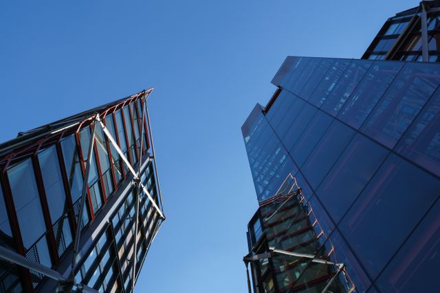 Modern High-rise Glass Buildings against Clear Blue Sky - Download Free Stock Photos Pikwizard.com