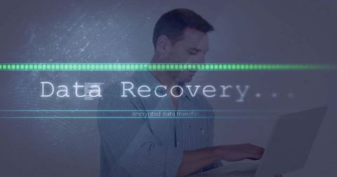 Data Recovery Progress Bar Overlaid on Man Using Laptop for Cybersecurity Forensics