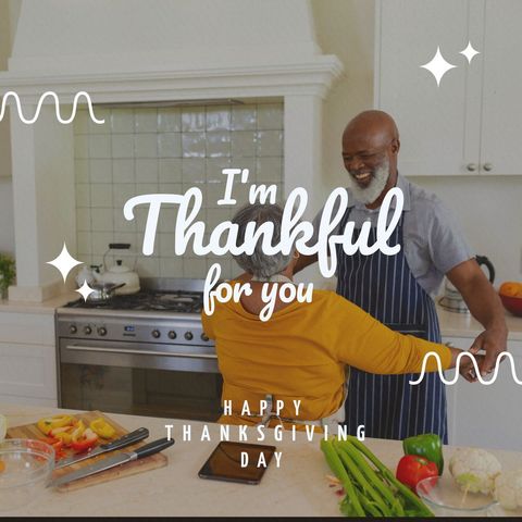 Senior couple joyfully dancing in kitchen for thanksgiving