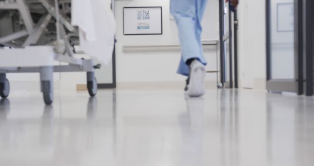 Healthcare Professional Walking in Modern Hospital Corridor - Download Free Stock Images Pikwizard.com