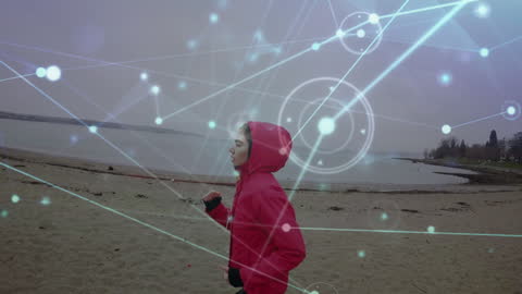Conceptual Technology Overlay of Woman Running on Beach