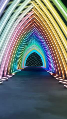 Vertical video showing immersive LED tunnel with arched lights cycling rainbow hues