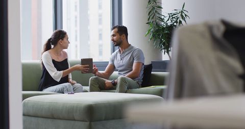 Colleagues Discussing Project on Tablet in Modern Office - Download Free Stock Images Pikwizard.com