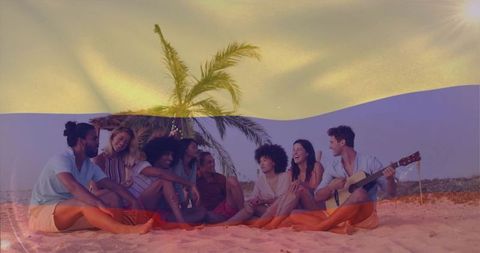 Friends enjoying sunset beach gathering playing acoustic guitar laughing relaxing on sand