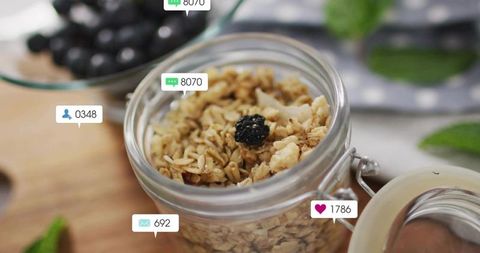 Displaying Granola Jar with Social Media Notifications on Wooden Board