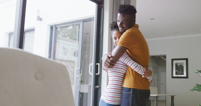 Image of happy african american couple embracing at home - Download Free Stock Photos Pikwizard.com