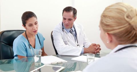 Healthcare Professionals Consulting with Patient in Medical Office - Download Free Stock Images Pikwizard.com