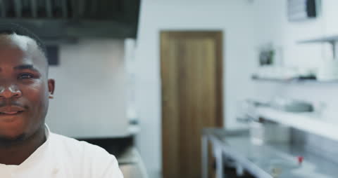 Happy Chef Smiling in Professional Kitchen