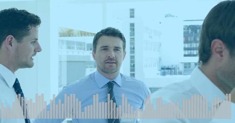 Business Professionals Analyzing Statistics in Modern Office