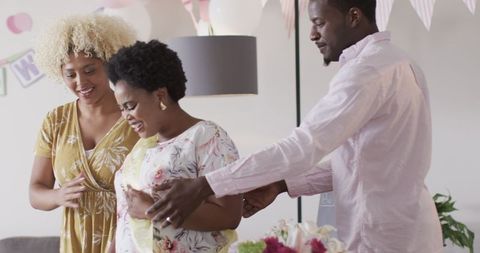Joyful Home Celebration with Expecting Mother and Friends