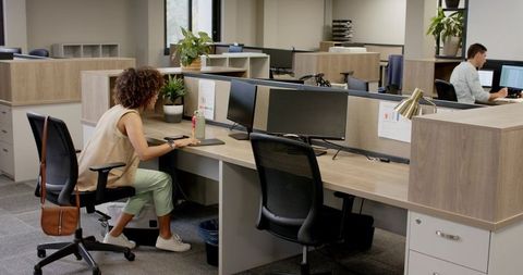 Modern open-plan office with focused coworkers and ample workspace