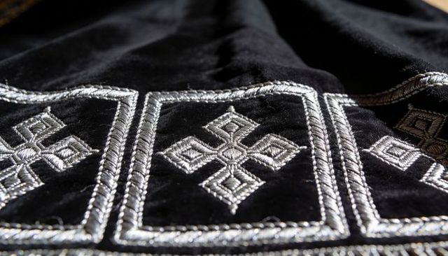 Black velvet with silver thread embroidery featuring geometric diamond cross panels