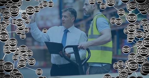 Warehouse Manager Discussing with Worker Amid Overlayed Digital Email Icons