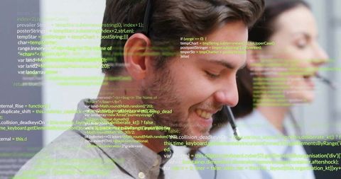 Smiling young professional in headset with code overlay