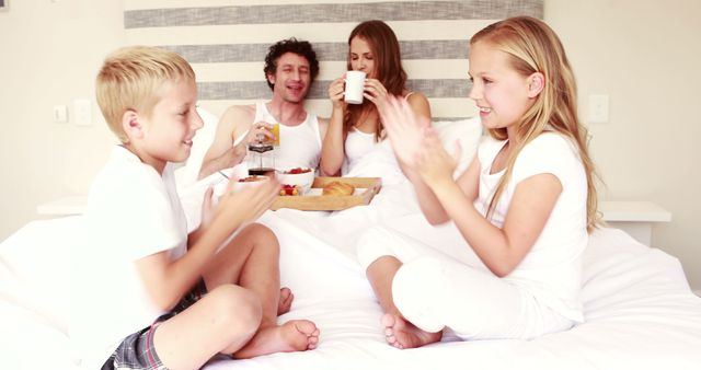 Family Enjoying Breakfast in Bed with Kids Playing Clap Game - Download Free Stock Images Pikwizard.com