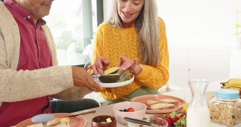 Senior Couple Enjoying Healthy Breakfast Together at Cozy Table