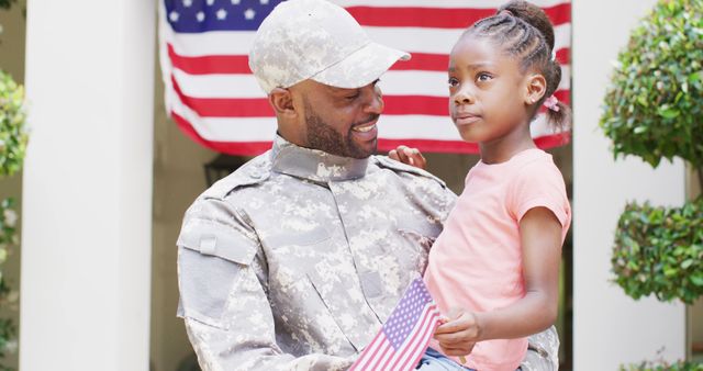Military Father Holding Young Daughter with American Flag Outdoors - Download Free Stock Images Pikwizard.com