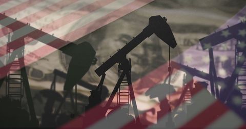 Oil Pump Jacks Against American Flag Symbolizing Energy and Economy