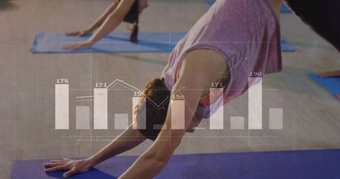 Woman practicing yoga in studio with graph overlay for wellness analytics