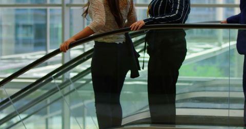 Business Colleagues Holding Rail on Escalator in Modern Office - Download Free Stock Images Pikwizard.com