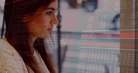 Focused woman analyzing data with advanced technology overlay