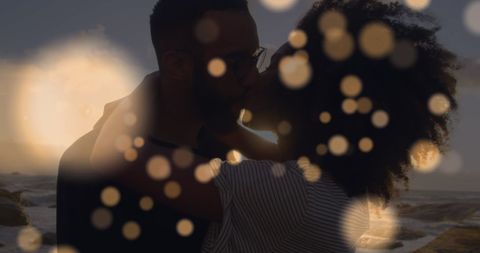Romantic African American Couple Embracing at Sunset Beach