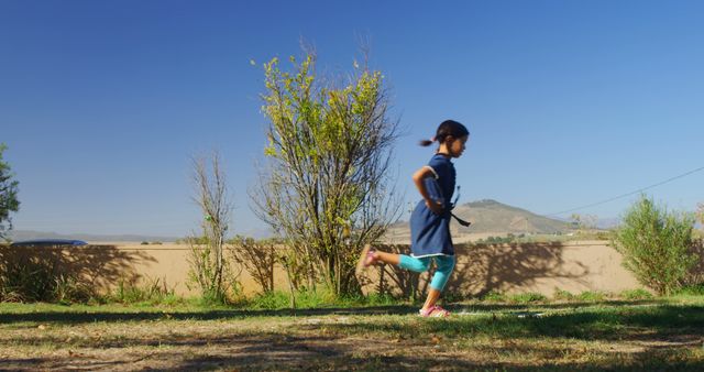 Young Girl Running Outdoors on a Sunny Day - Download Free Stock Images Pikwizard.com