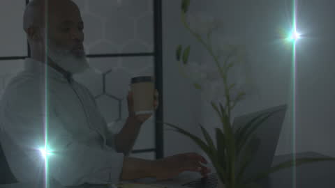 Businessman in Office with Digital Light Effects and Coffee