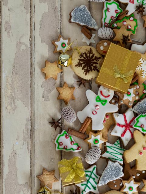 Assorted Christmas Cookies and Decorations on Wooden Plank - Download Free Stock Photos Pikwizard.com