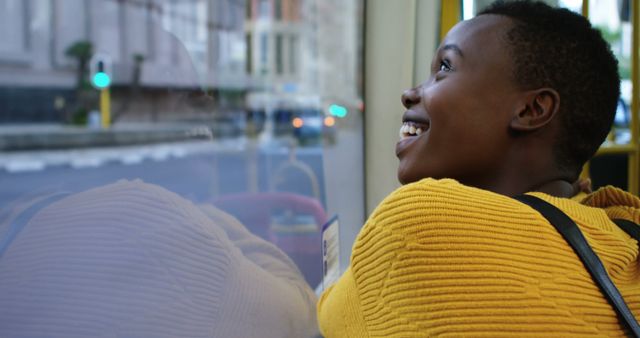 Smiling African American Woman Enjoying Views Through Window - Download Free Stock Images Pikwizard.com