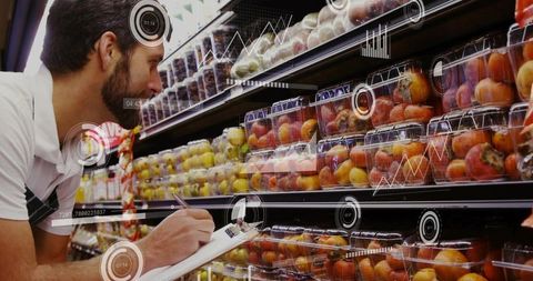 Grocery clerk inspecting packaged fruit inventory with clipboard and analytics hud