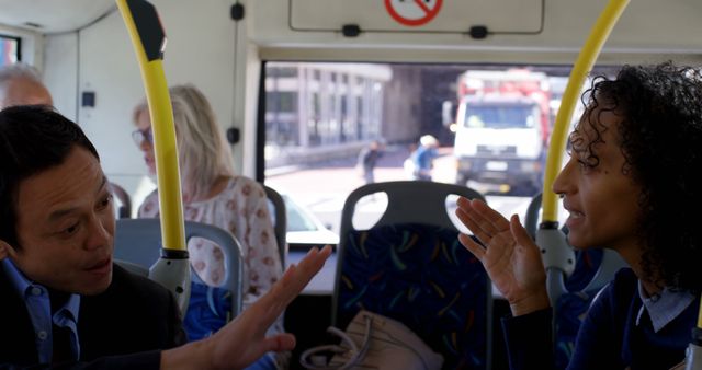 Two Business People Discussing on Public Bus - Download Free Stock Images Pikwizard.com