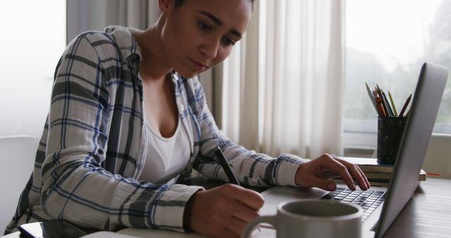 Young Woman Focusing on Work at Home Office Desk - Download Free Stock Images Pikwizard.com