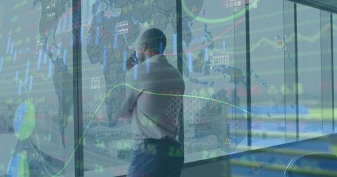 Businessman analyzing global market data with futuristic digital interface